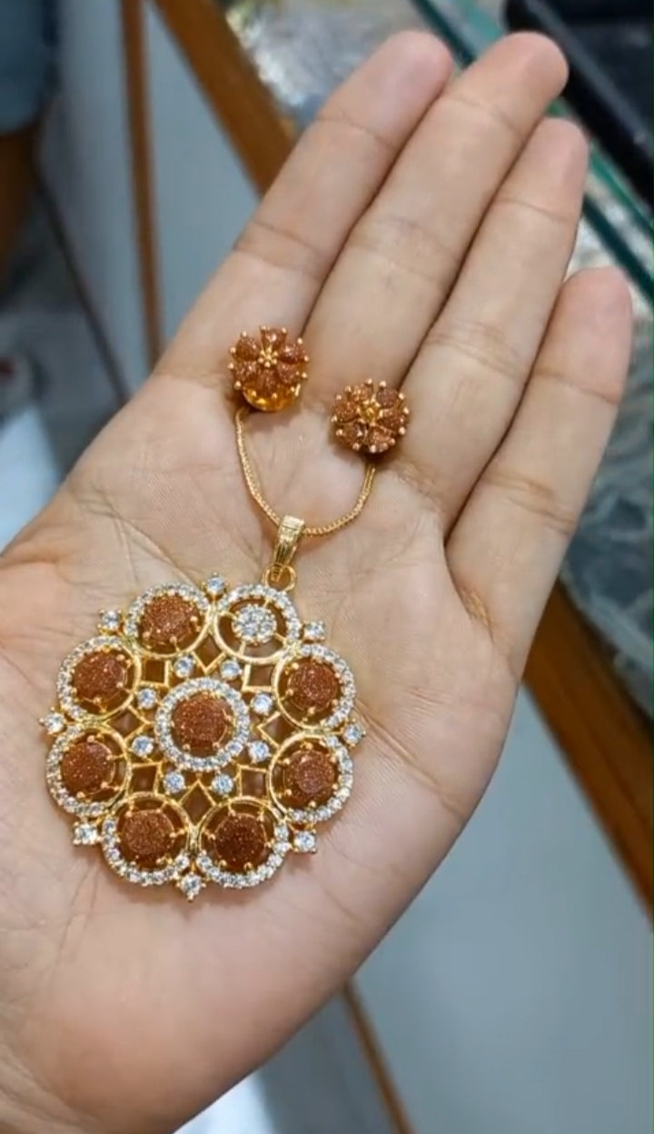 Beautiful Sand stone premium gold plated Pendant with plain chain necklace and matching ear studs
Code : PSBS1 Jewel byjuwaan